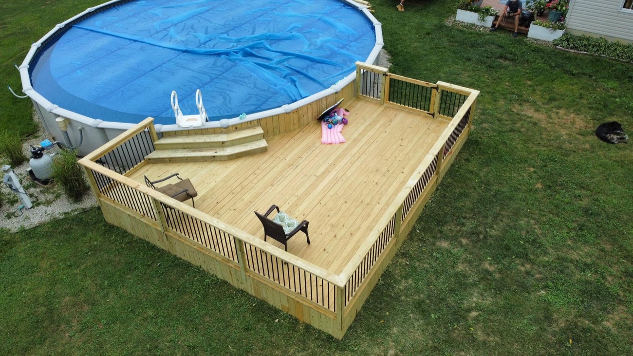 Wraparound wood deck around an above-ground pool