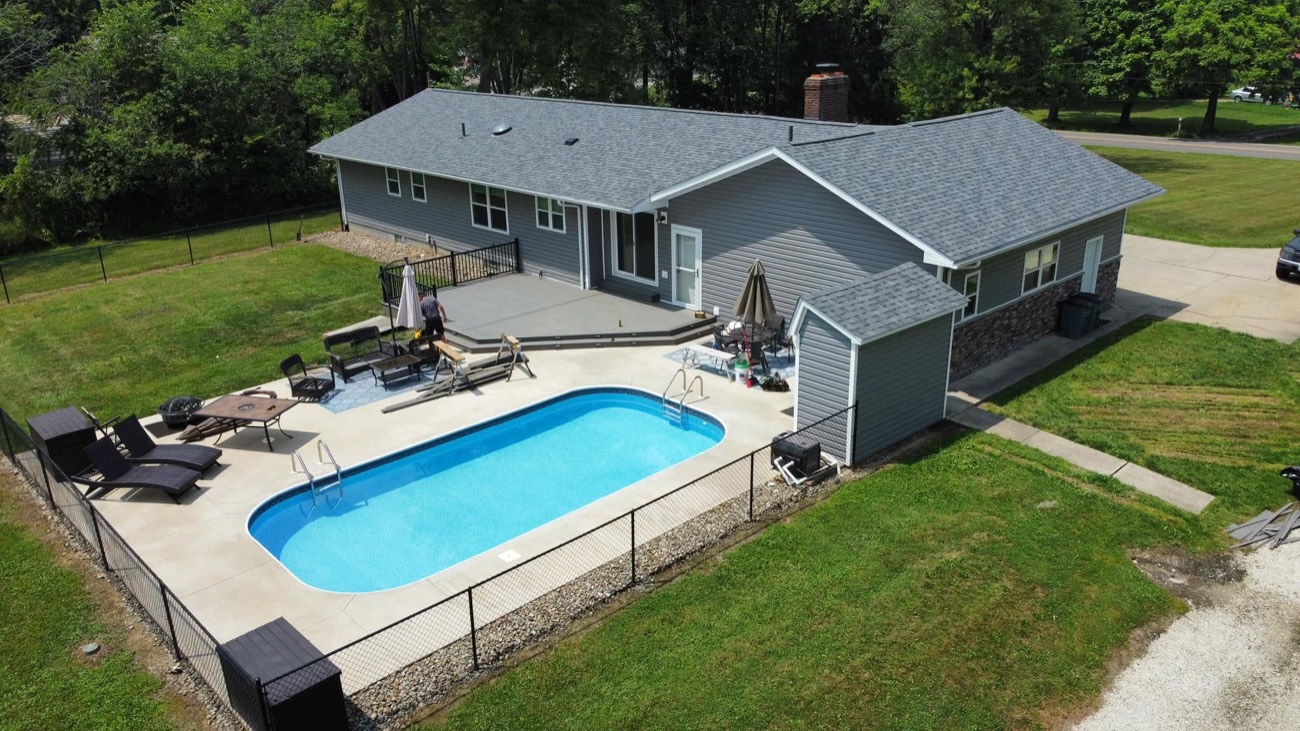 Composite deck beside an in-ground pool, aerial view