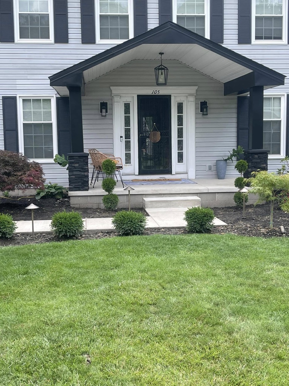 New front portico with columns and stone bases